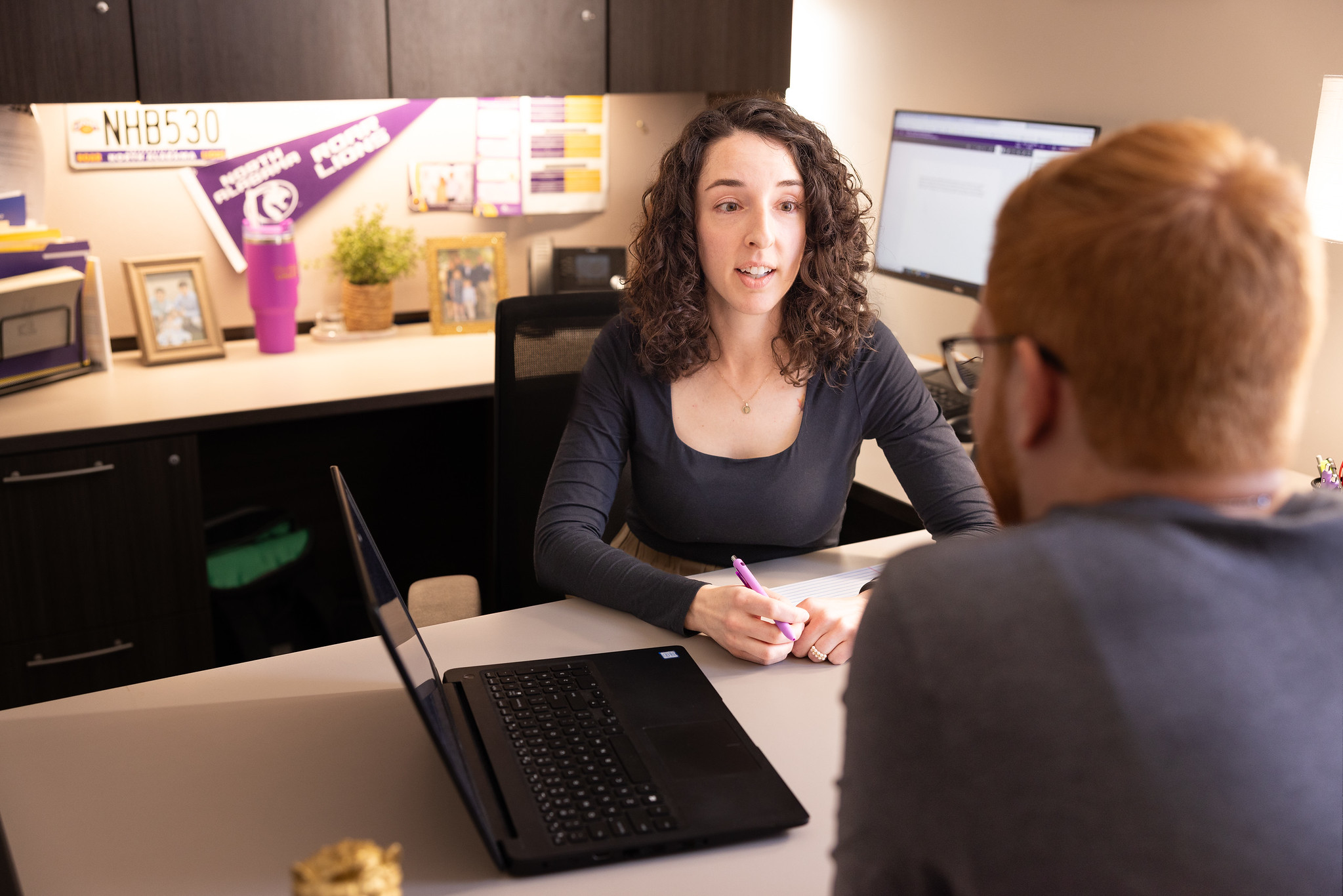 A UNA academic advisor meeting with a student.